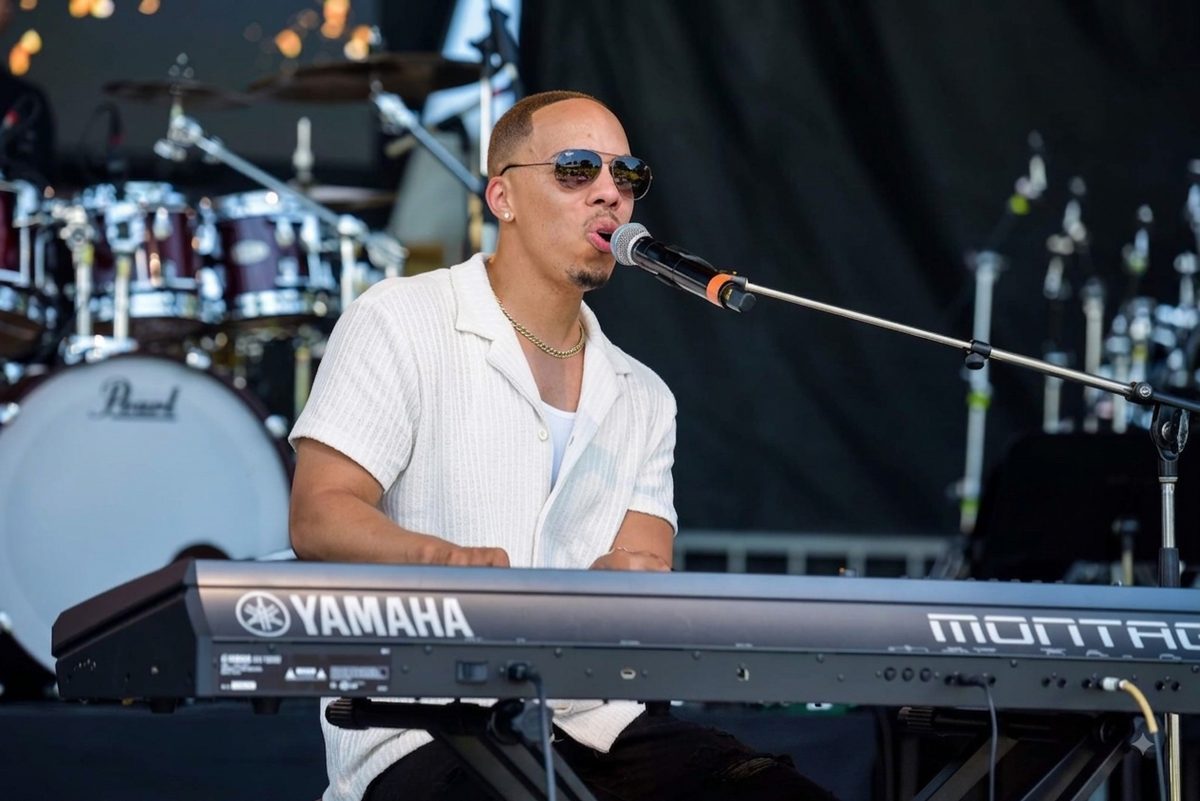 Jerel Crockett singing lead at the keys on the Richmond Jazz Festival main stage.